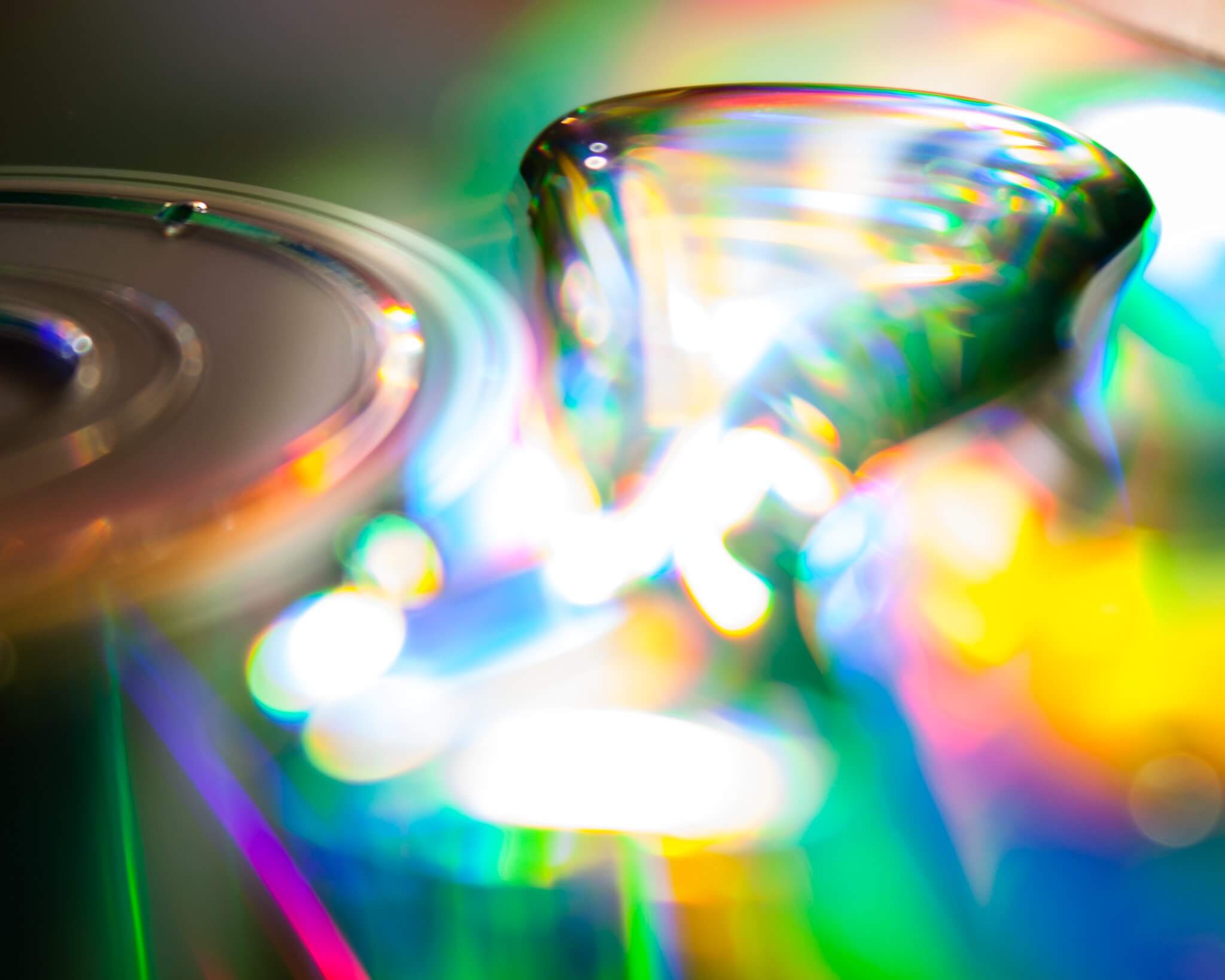 An abstract photograph of water droplets on a CD